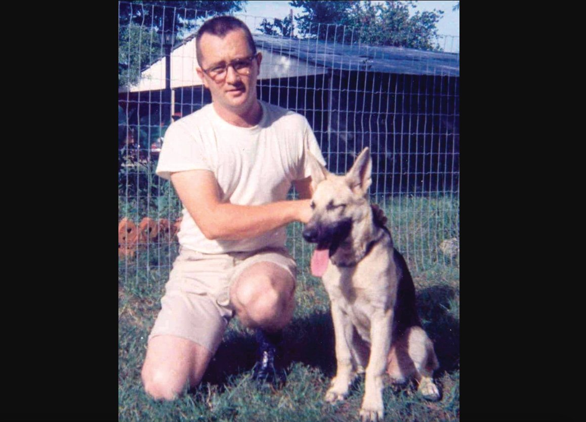 Melvin Holland poses with the family dog, Kelly, at the family home in Ellisville, Mississippi in 1967, where the family lived before moving to Woodland.